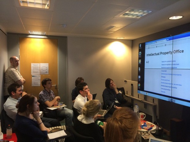 A team observes research in the GDS Research Studio viewing room