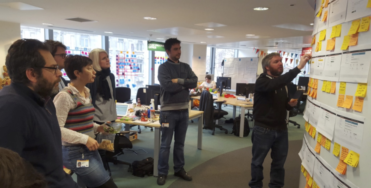 A researcher and their team working together to review a research session