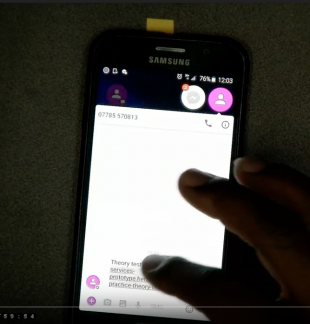An image showing a research participant clicking on a 'magic link' text message on a phone