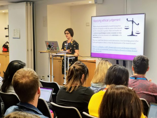 Lorna Wall, Head of User Research at Home Office giving a presentation on the history of research ethics