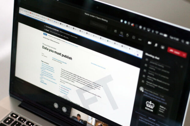 Laptop screen showing a user research session in which members of a service team review guidance on data they must publish