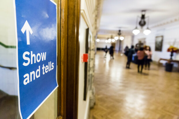 Wall with sign saying show and tell